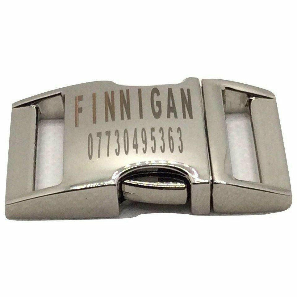 Metallic buckle with 'FINNIGAN' and a phone number engraved on a white background