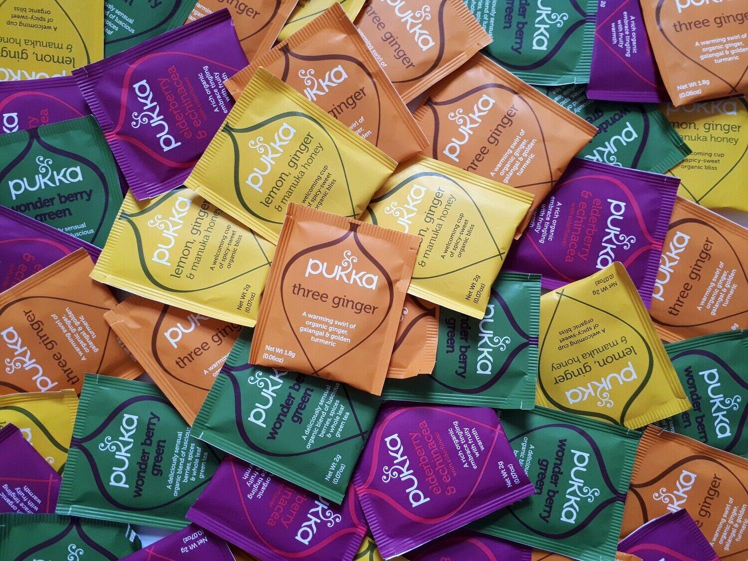 Assorted packets of Pukka tea in various colors and flavors.
