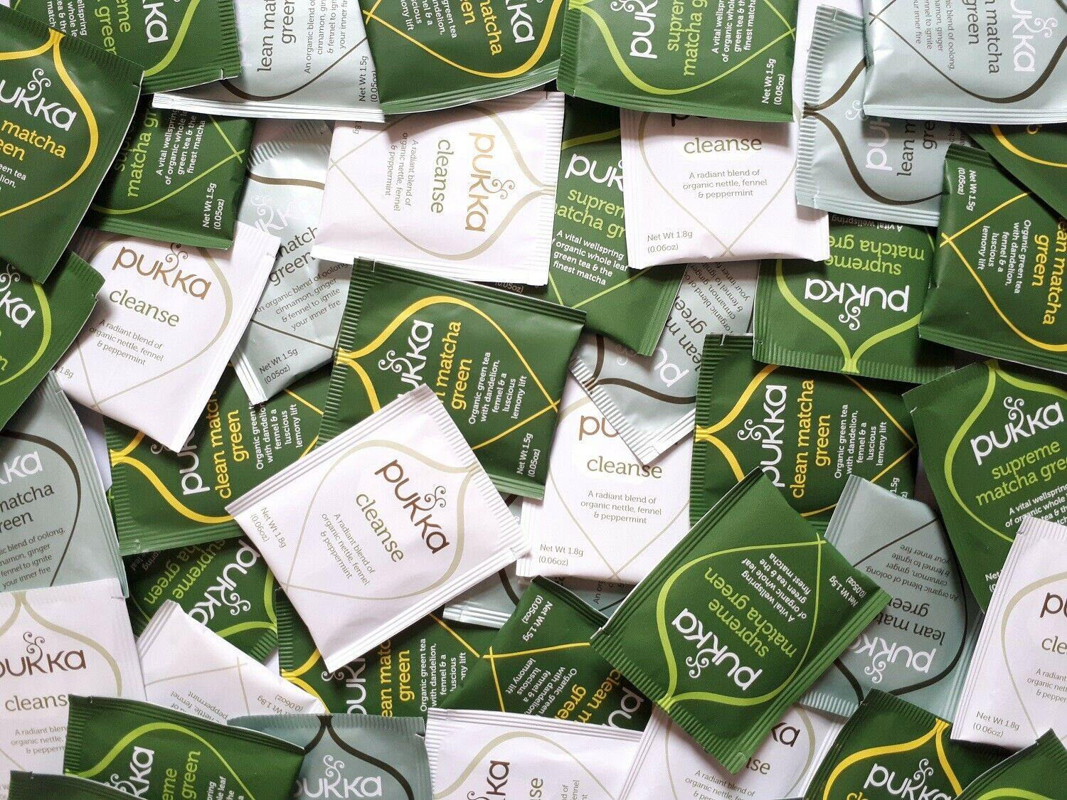 Pile of Pukka tea packaging in various flavors.