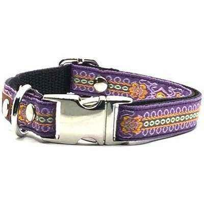 Purple dog collar with decorative patterns and a silver buckle on a white background