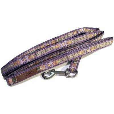 Purple dog leash with floral pattern on a white background