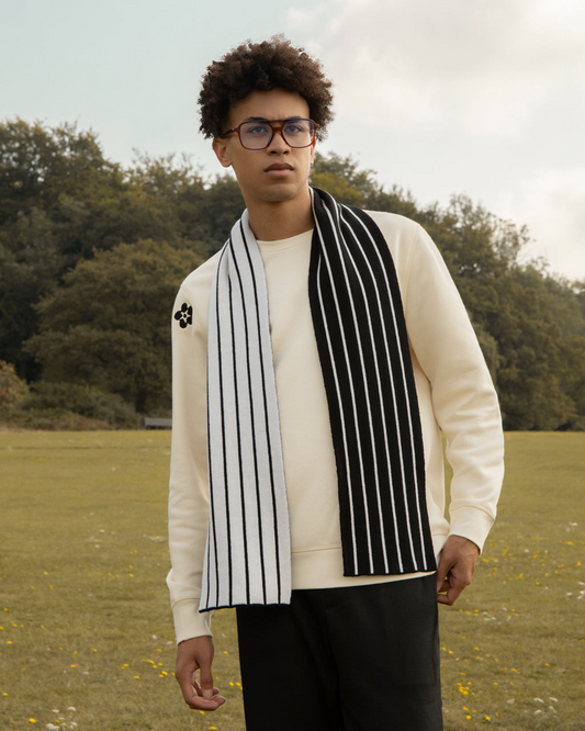 Man wearing a Stripes Wool & Cashmere Scarf Black in an outdoor setting