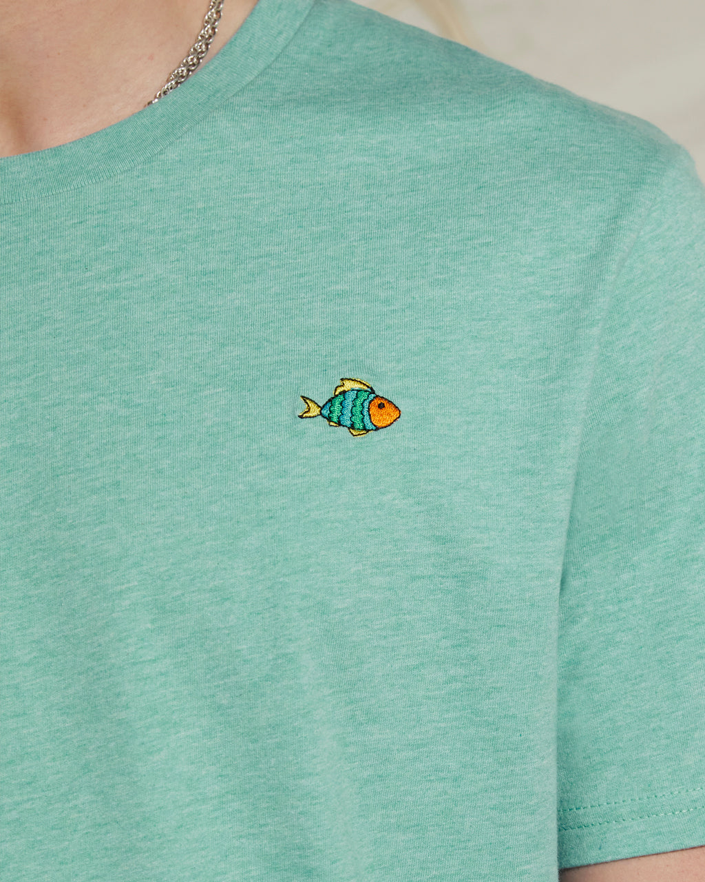 Heather Green - Super Soft Organic Cotton with a small fish embroidery on a plain background