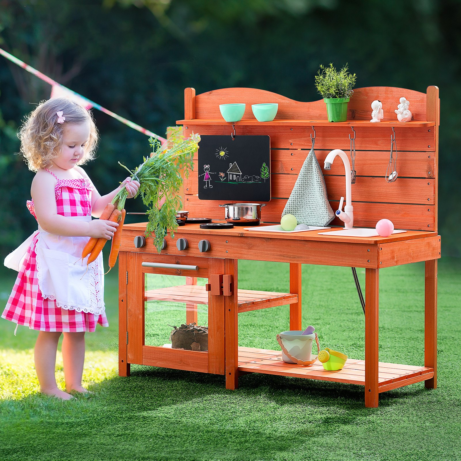 Child playing with a wooden play kitchen set outdoors