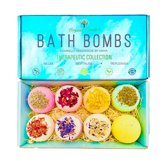 Box of bath bombs with decorative elements on a white background