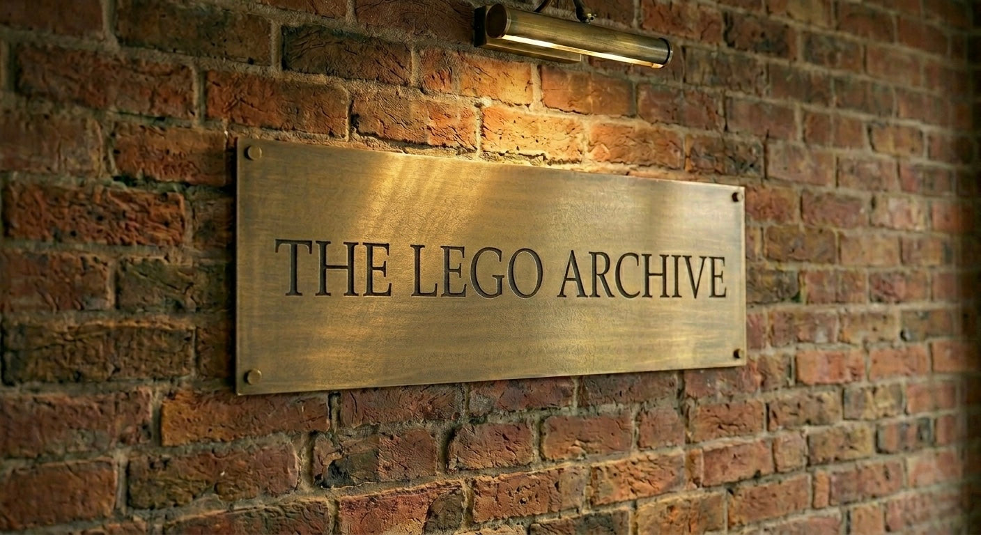 Brass plaque on a brick wall with 'The LEGO Archive' text.